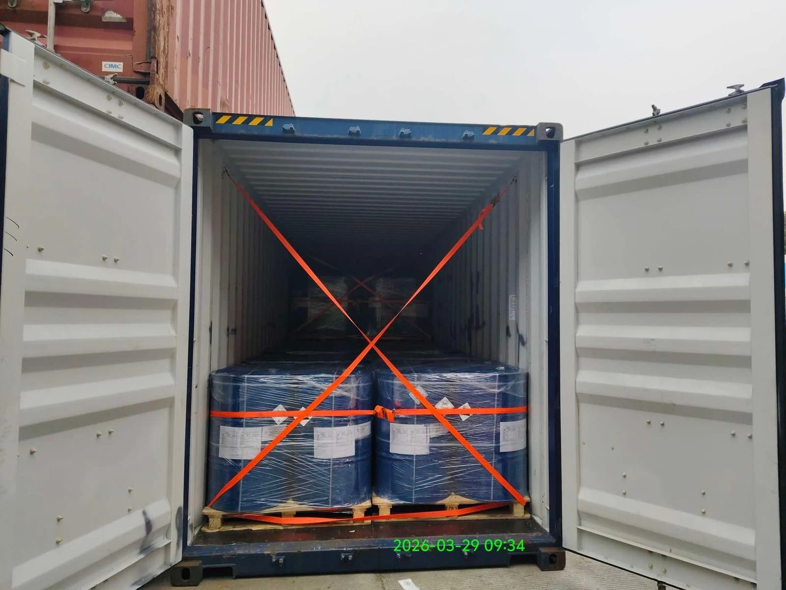 Shipment photograph: cargo and restraint straps viewed from the doors.