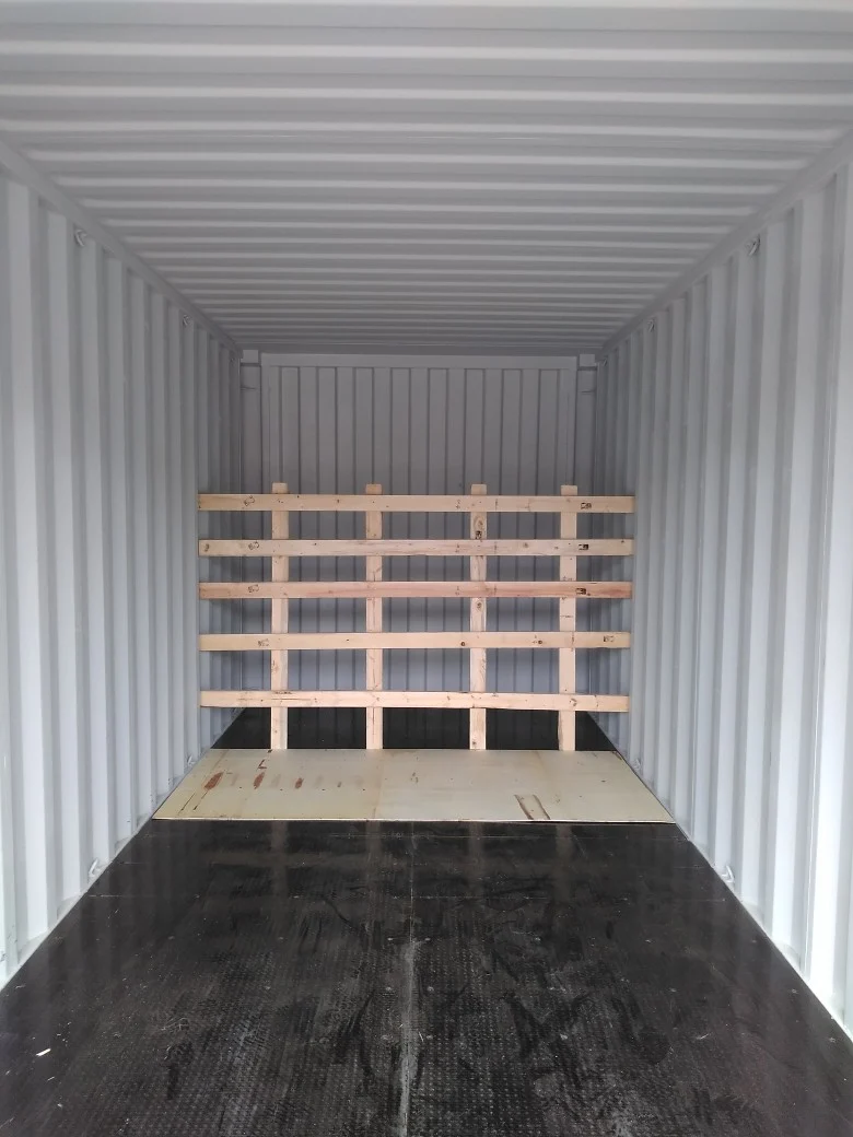 Shipment photograph: timber arrangement at the far end of the container before loading.